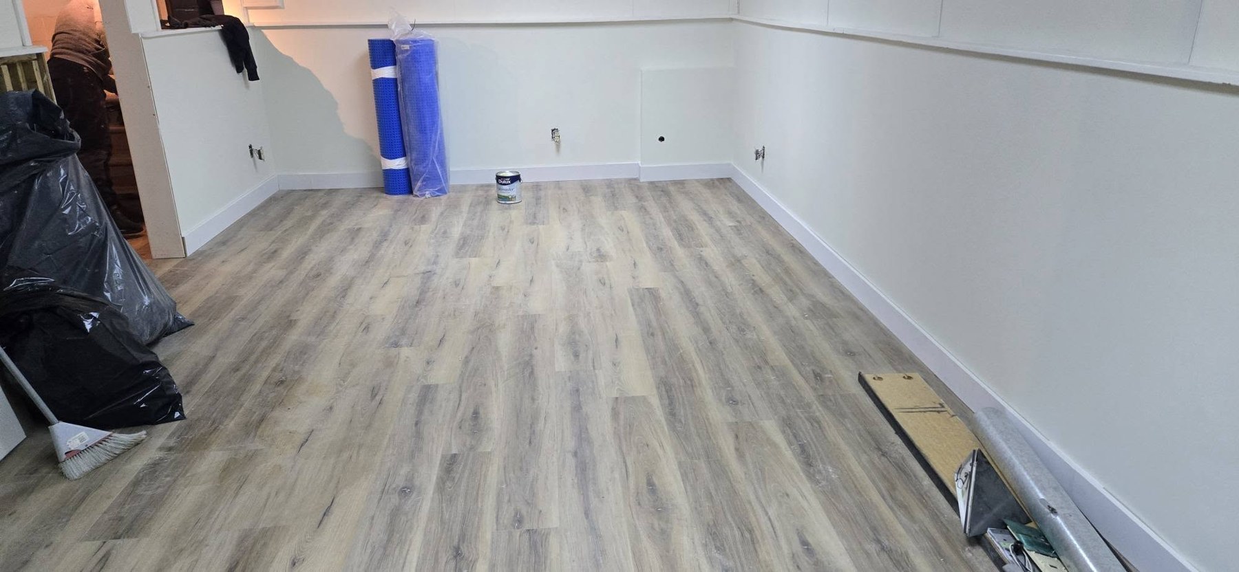 B&M wood-look plank flooring project in a basement